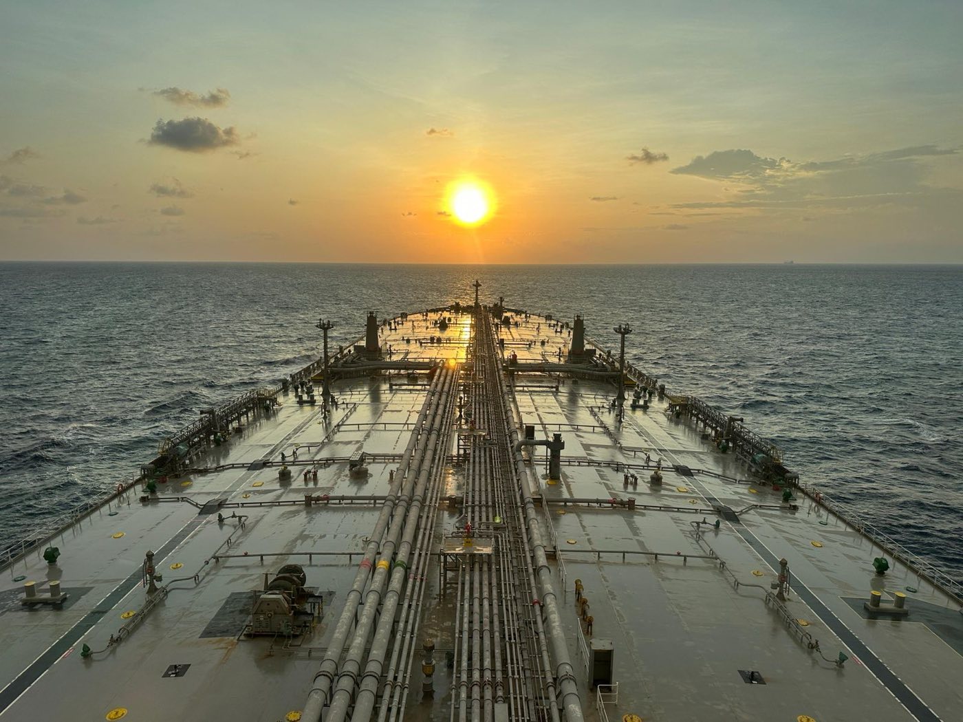 Tanker deck and product pipelines at sunset, underway at sea